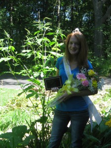 Me in my far finery beside the weed that is taller than I am.
